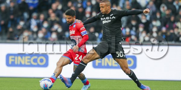SSC Napoli's Italian striker Lorenzo Insigne challenges for the ball with Udinese's Brazilian defender Rodrigo Becao during the Serie A football match between SSC Napoli and Udinese. Napoli won 2-1