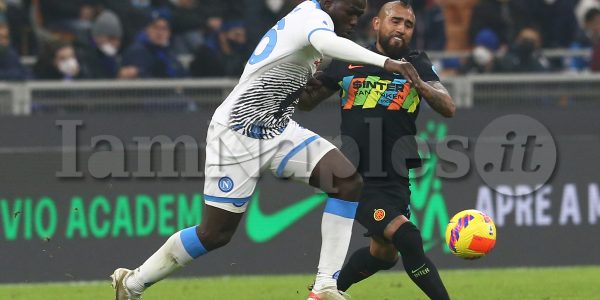 SSC Napoli's Senegalese defender Kalidou Koulibaly  challenges for the ball with InterÕs Chilean midfielder Arturo Vidal during the Serie A football match between SSC Napoli and Inter at the Giuseppe Meazza Stadium Milan, North Italy, on November 21, 2021.
