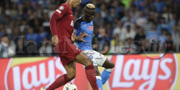 SSC Napoli's Nigerian striker Victor Osimhen challenges for the ball with Liverpool's Dutch defender Virgil van Dijkduring the Champions League Group A football match between SSC Napoli and Liverpool at Diego Armando Maradona stadium in Naples, southern Italy, on September 7, 2022.